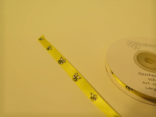 Gult gavebånd med bier